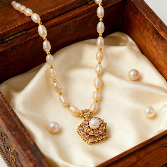 Transfer Bead Natural Freshwater Pearl Necklace displayed in a wooden jewelry box with pearls.